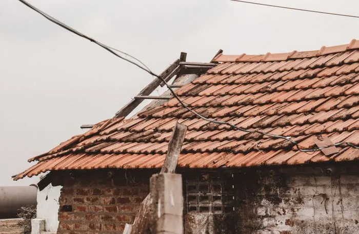 Missing shingles on an aging residential roof